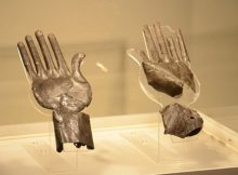 Silver hands in ancient tomb