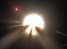 This illustration shows a star behind a shattered comet. Observations of the star KIC 8462852 by NASA's Kepler and Spitzer space telescopes suggest that its unusual light signals are likely from dusty comet fragments, which blocked the light of the star as they passed in front of it in 2011 and 2013. The comets are thought to be traveling around the star in a very long, eccentric orbit. Credits: NASA/JPL Caltech