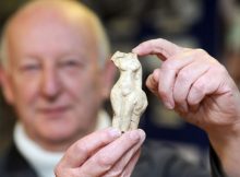 John Broughton is pictured with the Venus statue at the Long Melford Heritage Centre. Credits: East Anglian Daily Times