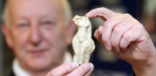 John Broughton is pictured with the Venus statue at the Long Melford Heritage Centre. Credits: East Anglian Daily Times