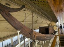 Tourists visit the ancient Pharaoh king Cheops' first solar boat, which was removed in pieces in 1954 and painstakingly reconstructed, during their visit to the boat museum at the Pyramids site in Giza, Egypt, Wednesday, March 29, 2017. (AP Photo/Amr Nabil)