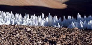 An example of the penitentes from the southern end of the Chajnantor plain in Chile. Though these ice formations only reach a few feet in height, while Pluto’s bladed terrain reaches hundreds of feet, they both have similar sharp ridges. Credits: Wikimedia Commons/ESO