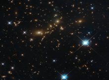 NASA/ESA Hubble Space Telescope image shows a massive galaxy cluster glowing brightly in the darkness. Despite its beauty, this cluster bears the distinctly unpoetic name of PLCK G308.3-20.2. Image credit: ESA/Hubble & NASA, RELICS