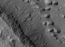 Layers and mounds in Medusae Fossae Formation, as seen by HiRISE under HiWish program Location is East of Gale Crater in the Aeolis quadrangle.