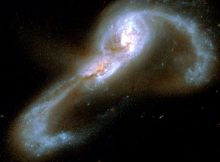 The colliding galaxy pair VV705. Astronomers have measured a set of merging galaxies to determine the relative contributions to luminosity from star formation versus from accretion around the supermassive black hole nucleus. For VV705, they find that nearly 75% of the luminosity comes from star formation. Credit: NASA/Hubble