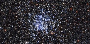 An image of the Wild Duck Cluster was captured by the MPG/ESO 2.2-metre telescope at the La Silla Observatory in Chile. The blue stars at the center of the image are the stars of the cluster. Every star in the Wild Duck Cluster is roughly 250 million years old. Older, redder stars surround the cluster. (Image: European Southern Observatory)