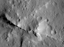 NASA's Dawn spacecraft captured this 12.5-mile-across close-up of the central peak of the 99-mile-wide Urvara impact crater on Ceres. The remarkable 6,500-foot central ridge is made from materials uplifted from depth, arising from terrains enriched with products of rock-water interactions, such as carbonates. Credit: NASA/JPL-Caltech/UCLA/MPS/DLR/IDA