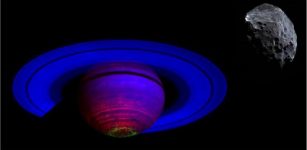 Cassini VIMS infrared view of Saturn. Blue is infrared light where water ice reflects relatively brightly. Red is longer wavelength thermal emission showing heat from deep inside the planet. Green is infrared wavelengths where aurora emit light. Above image upper right: Phoebe in visible light. Phoebe is very dark, like charcoal whereas the rings are very bright in visible light like slightly dirty snow. Phoebe is not to scale relative to Saturn. Credit: NASA, JPL, VIMS Team, ISS Team, U. Arizona, D. Machacek, U. Leicester