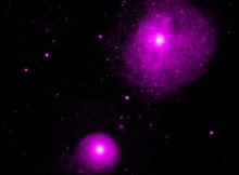 This image from NASA's Chandra X-ray Observatory shows the region around NGC 1399 and NGC 1404, two of the largest galaxies in the Fornax galaxy cluster. Located at a distance of about 60 million light years, Fornax is one of the closest galaxy clusters to Earth. This relative proximity allows astronomers to study the Fornax cluster in greater detail than most other galaxy clusters.