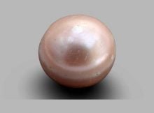 The 8,000-year-old pearl, which was discovered in 2017, is less than a third of a centimeter in diameter and in photos, appears to be pale pink in color.