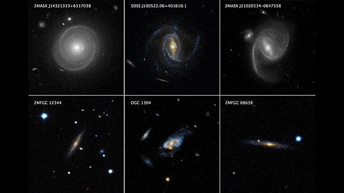 The top row of this mosaic features Hubble images of three spiral galaxies, each of which weighs several times as much as the Milky Way. The bottom row shows three even more massive spiral galaxies that qualify as “super spirals,” which were observed by the ground-based Sloan Digital Sky Survey. Super spirals typically have 10 to 20 times the mass of the Milky Way. The galaxy at lower right, 2MFGC 08638, is the most massive super spiral known to date, with a dark matter halo weighing at least 40 trillion Suns. (Image: Top row: NASA, ESA, P. Ogle and J. DePasquale (STScI). Bottom row: SDSS, P. Ogle and J. DePasquale (STScI)