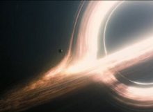 A disk of glowing gas swirls into the black hole "Gargantua" from the movie Interstellar. Because space curves around the black hole, it is possible to look round its far side and see the part of the gas disk that would otherwise be hidden by the hole. Our understanding of this mechanism has now been increased by Danish master's student at NBI, Albert Sneppen (credit: interstellar.wiki/CC BY-NC License).