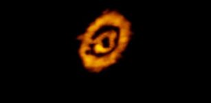 A false-color, submillimeter wavelength image of the protoplanetary disk around the star IM Lup showing dual rings of gas and dust. Astronomers for the first time have determined the vertical heights of both the dust and gas components in this and two other protostellar systems using multiwavelength datasets, finding that at large distances from the star they sometimes but not always have the same flaring profile. Credit: K. Oberg, CfA, et al.; ALMA (NRAO/ESO/NAOJ); B. Saxton (NRAO/AUI/NSF)