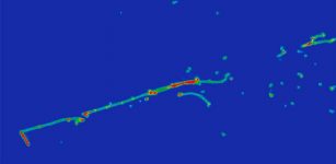 This approximately 70-centimeter-wide image depicts a MicroBooNE electron neutrino event, with an electron shower (straight line and dots bottom left to top right) and a proton track (short red line at bottom left). MIT researchers have been using the MicroBooNE experiment at Fermilab to uncover new secrets behind neutrinos. Credit: MicroBooNE Collaboration.