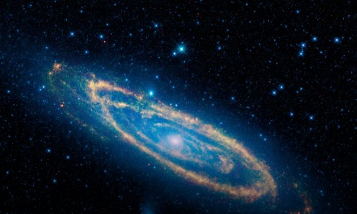 Gravitational 'kick' may explain the strange shape at the center of Andromeda