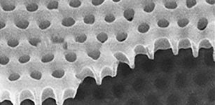 Using a material called yttrium barium copper oxide arrayed with tiny holes, researchers have discovered "strange metal" behavior in a type of system where charge carriers are bosons, something that's never been seen before.