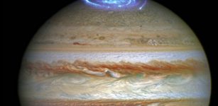 Composite image of two different Hubble observations. The aurorae were photographed during a series of Hubble Space Telescope Imaging Spectrograph far-ultraviolet-light observations taking place as NASA's Juno spacecraft approaches and enters into orbit around Jupiter. The full-colour disk of Jupiter in this image was separately photographed at a different time by Hubble's Outer Planet Atmospheres Legacy (OPAL) program, a long-term Hubble project that annually captures global maps of the outer planets. Credit: NASA, ESA, and J. Nichols (University of Leicester).