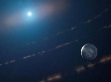 An artist’s impression of the white dwarf star WD1054–226 orbited by clouds of planetary debris and a major planet in the habitable zone.