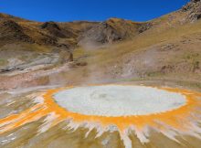 Pictured is a continuously spouting cauldron of near-boiling water, one of a dozen spanning a 10-acre geothermal field at Mangra in southern Tibet. Helium-isotope geochemistry shows it sits above the northern edge of the Indian plate 50 miles below, where India is underthrusting Asian crust to build the Himalayas and Tibetan Plateau. Credit: Ping Zhao