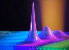 A laser beam (orange) creates excitons (purple) that are trapped inside the semicondcutor material by electric fields. Credit: Puneet Murthy / ETH Zurich