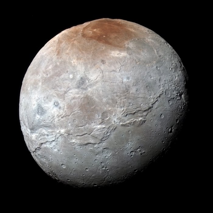 Southwest Research Institute scientists combined data from NASA's New Horizons mission with novel laboratory experiments and exospheric modeling to reveal the likely composition of the red cap on Pluto's moon Charon and how it may have formed. New findings suggest drastic seasonal surges in Charon's thin atmosphere combined with light breaking down the condensing methane frost may be key to understanding the origins of Charon's red polar zones. Credit: NASA / Johns Hopkins APL / SwRI