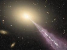 Artist's impression of a giant galaxy with a high-energy jet. Credit: ALMA (ESO/NAOJ/NRAO)