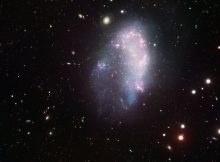 The dwarf galaxy NGC1427A flies through the Fornax galaxy cluster and undergoes disturbances which would not be possible if this galaxy were surrounded by a heavy and extended dark matter halo, as required by standard cosmology. Credit: ESO