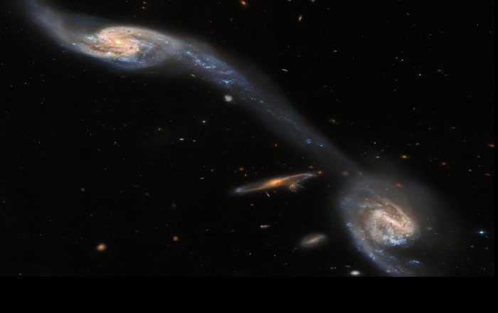 Hubble Inspects Two Galaxies Connected By A Luminous Bridge