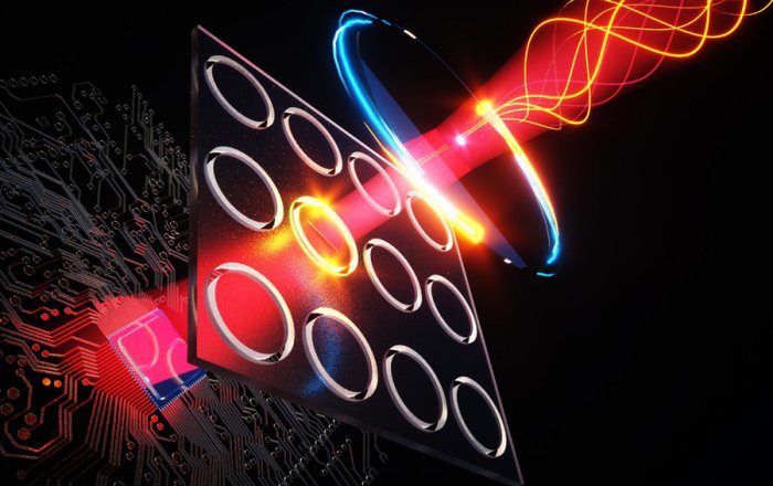 Illustration shows terahertz illumination (yellow curves at top right) entering the new camera system, where it stimulates quantum dots inside nanoscale holes (shown as illuminated rings) to emit visible light, which is then detected using a CMOS-based chip (bottom left) like those in digital cameras. Credits:Courtesy of the researchers