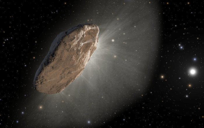 An artist's depiction of the interstellar comet 'Oumuamua, as it warmed up in its approach to the sun and outgassed hydrogen (white mist), which slightly altered its orbit. The comet, which is most likely pancake-shaped, is the first known object other than dust grains to visit our solar system from another star. Credit: NASA, ESA and Joseph Olmsted and Frank Summers of STScI