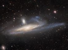 Dark Energy Camera Captures Galaxies In Lopsided Tug Of War - A Prelude To Merger