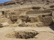 Pre-Inca Temple With Colored Paintings And Carved Sculptures Discovered At The Los Paredones Archaeological Complex, Peru