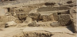 Pre-Inca Temple With Colored Paintings And Carved Sculptures Discovered At The Los Paredones Archaeological Complex, Peru