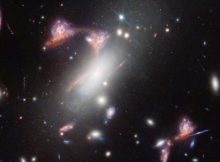 Webb Reveals Distorted Galaxy Forming Cosmic Question Mark