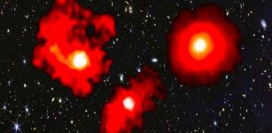 Discovery Of Three Galactic 'Red Monsters' In Early Universe Challenges Current Galaxy Formation Models